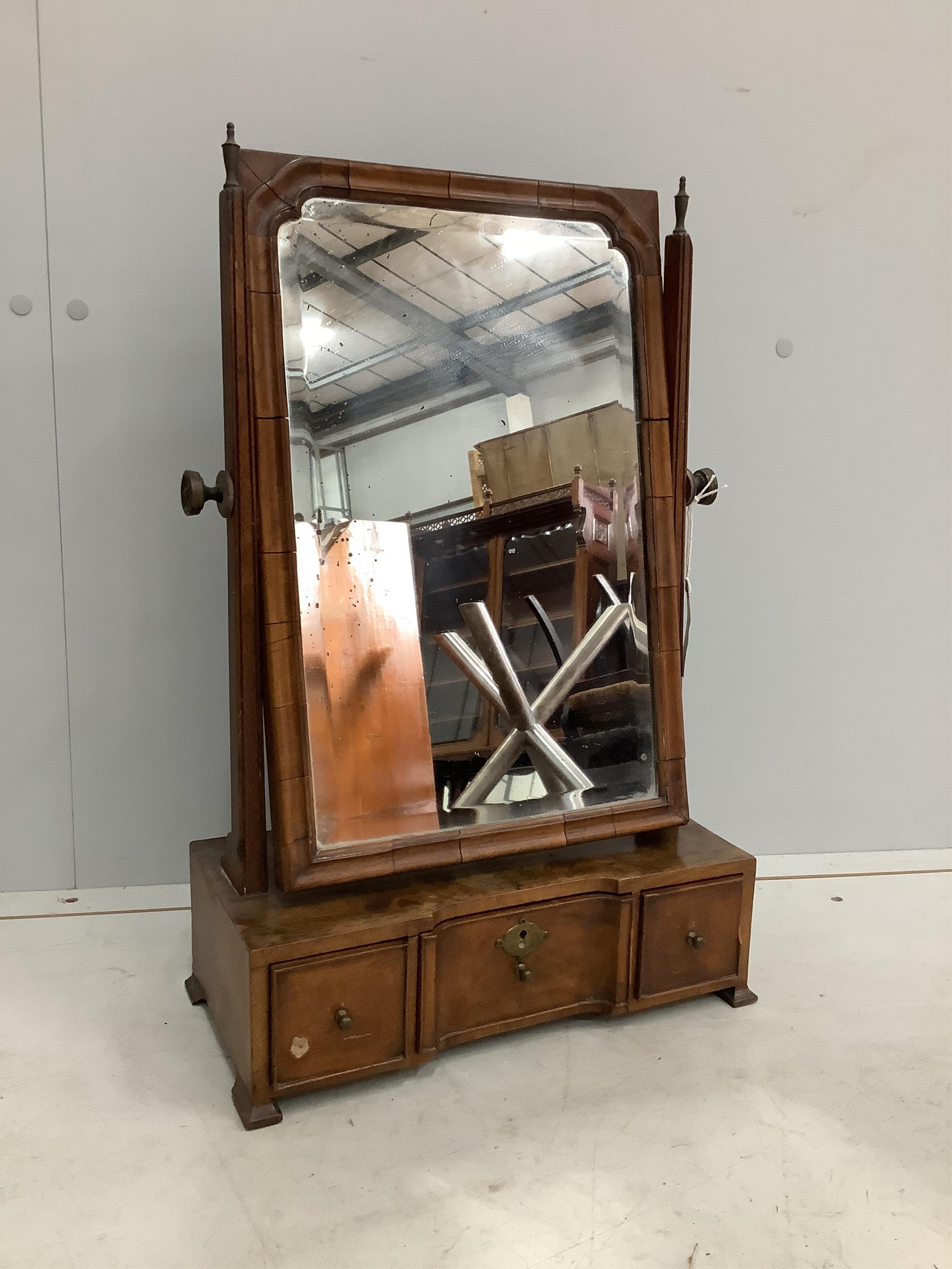 An 18th century walnut toilet mirror, width 36cm, depth 17cm, height 57cm